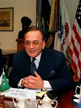 Khurshid Mahmud Kasuri seated at a bilateral meeting, behind a nameplate reading Minister of Foreign Affairs.