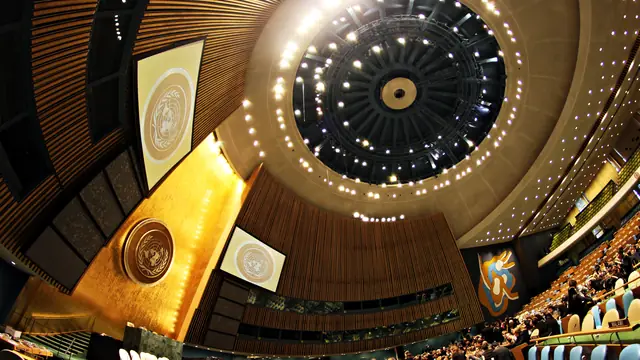 The United Nations General Assembly Hall in New York, empty, seen from the rear of the chamber.