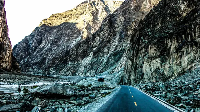 The Karakoram Highway threading through mountains near Chalt in northern Pakistan, one of the region's principal overland trade routes.